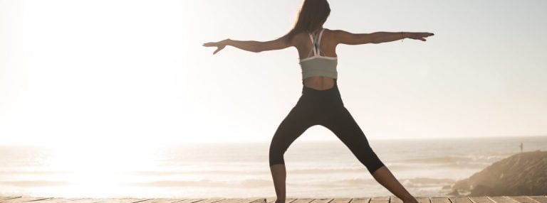 Women doing pilates on the beach in lagos